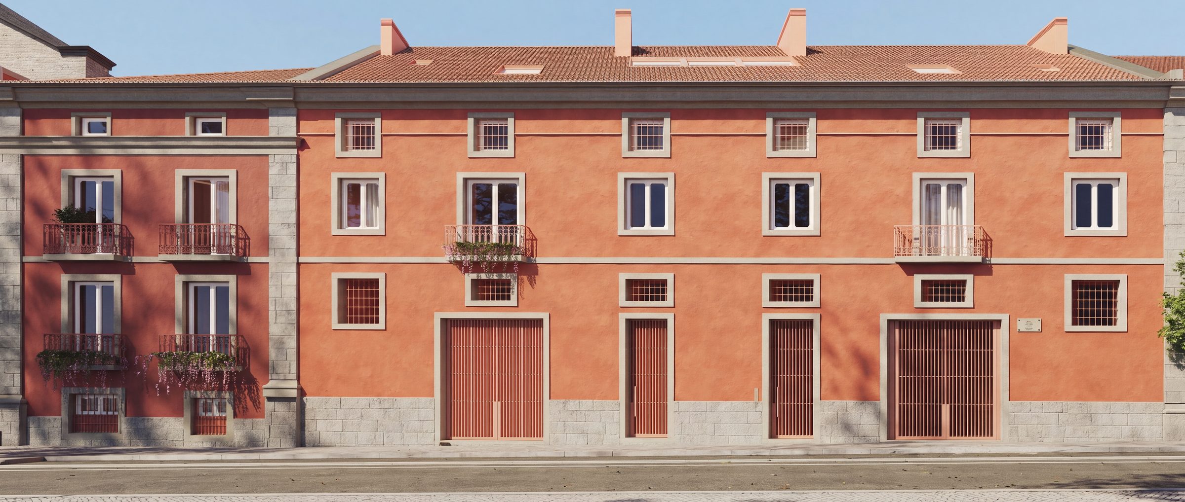 The restored Beato Quarter facade in terracotta, with wrought-iron balconies and gated doorways